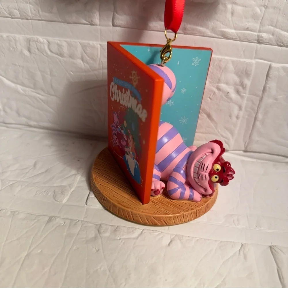 New Disney Cheshire Cat Christmas Ornament in Book Red and Purple